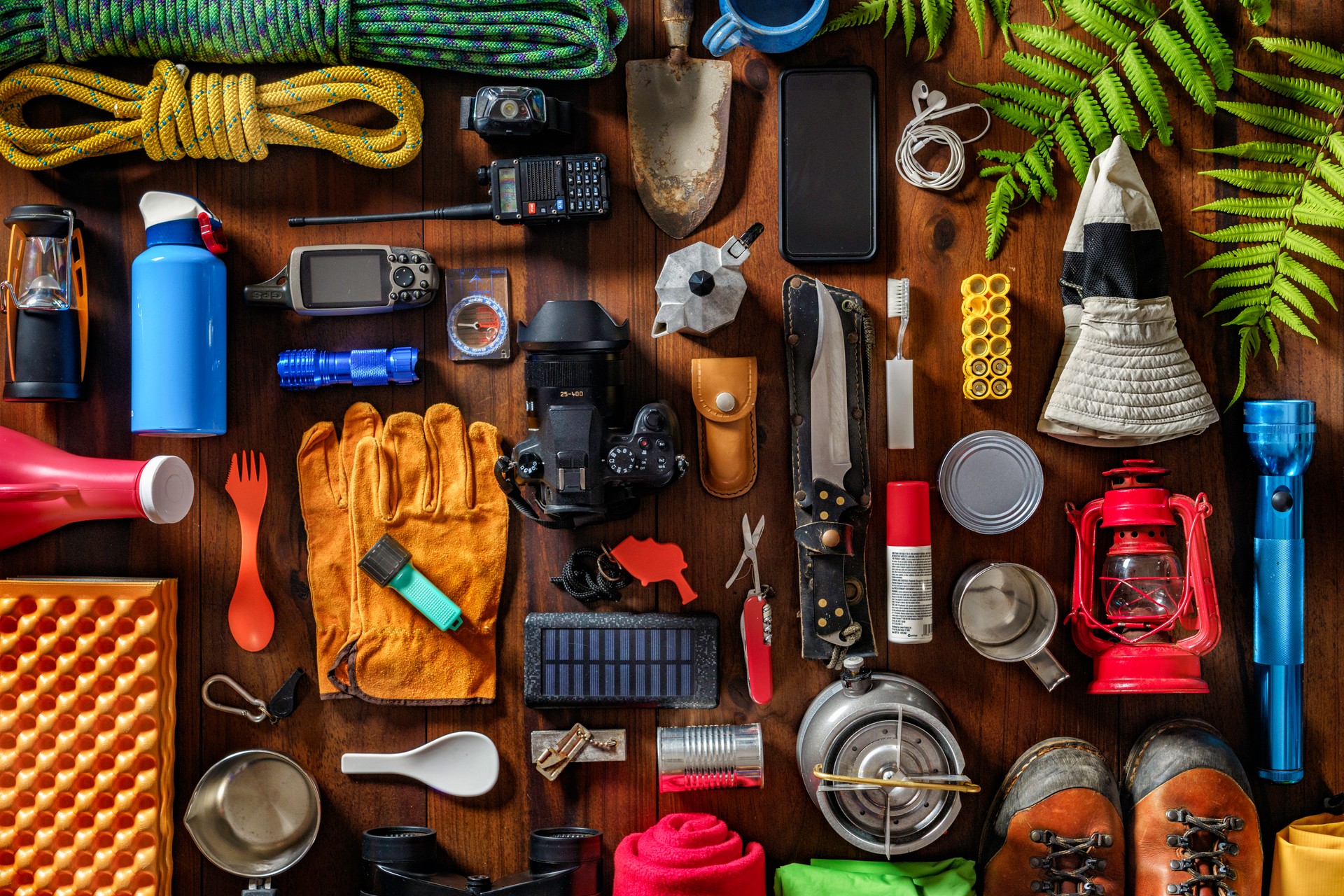Top view camping and hiking travel and hiking gear, equipment and accessories for mountain trips